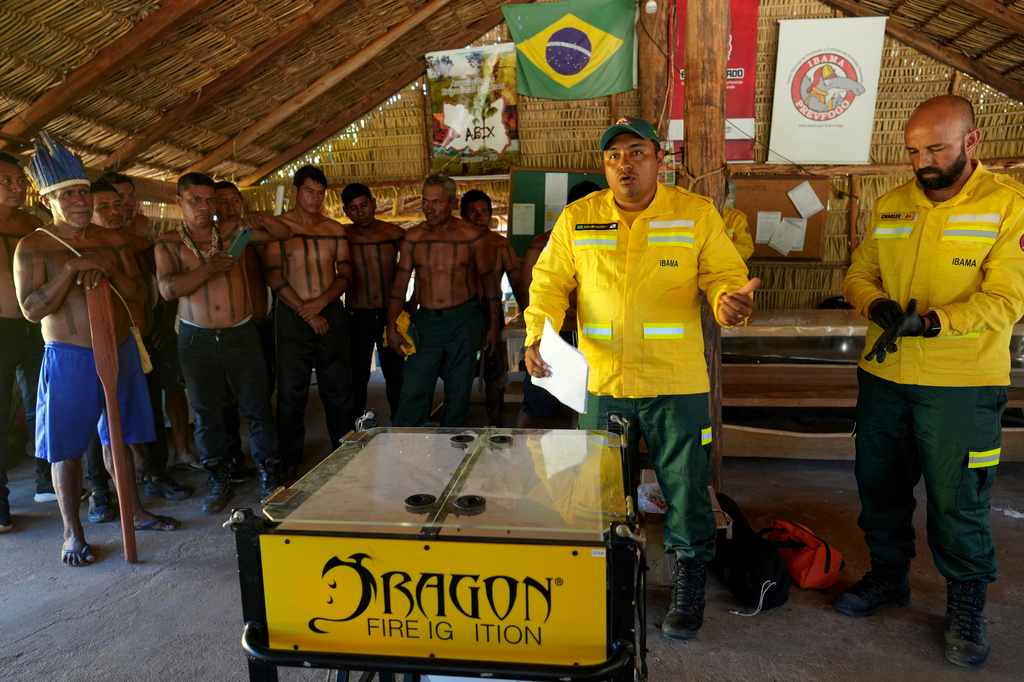 Xerente Indigenous people attend a fire prevention operation along Brazil's environmental protection agency, IBAMA, at the Xerente territory, near Tocantinia, Tocantins state, Brazil, Tuesday, May 19, 2026. (AP Photo/Andre Penner)