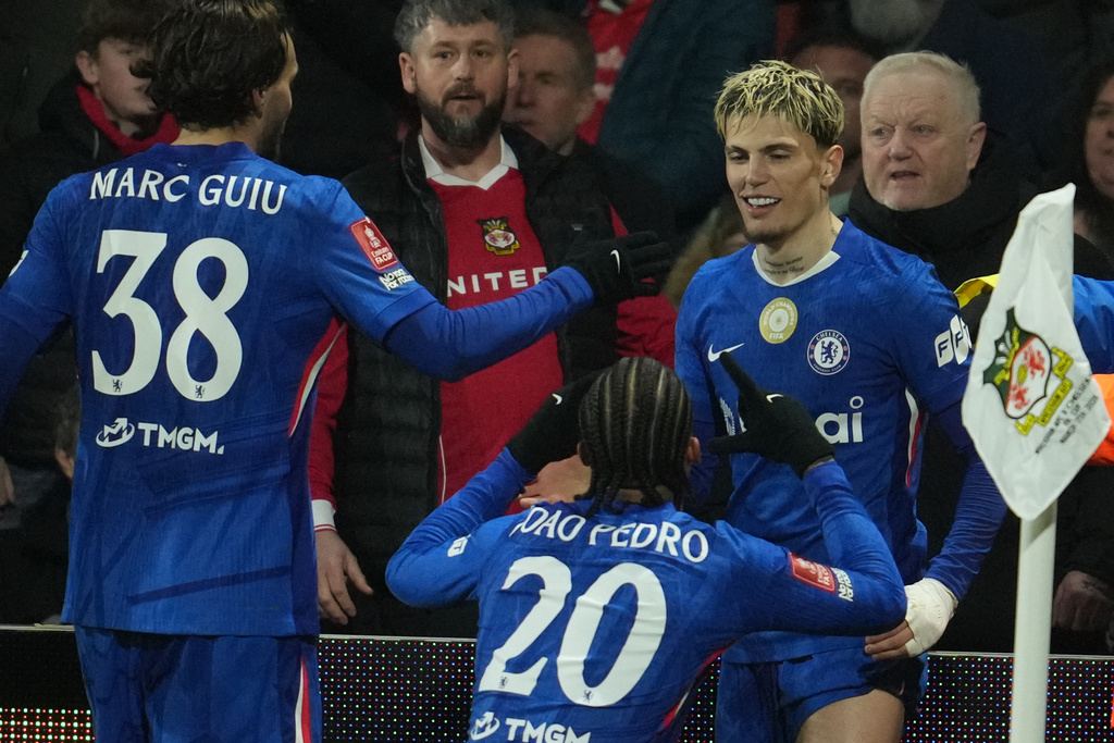 Chelsea players celebrate after a goal during the fifth round FA Cup soccer match between Wrexham and Chelsea in Wrexham, Wales, Saturday, March 7, 2026. (AP Photo/Jon Super)