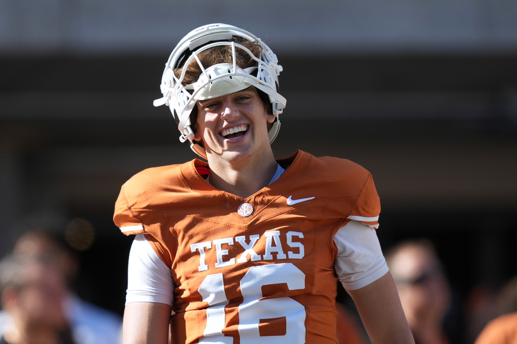 Texas quarterback Arch Manning (16) warms up before an NCAA college football game against Florida in Austin, Texas, Saturday, Oct. 17, 2026. (AP Photo/Eric Gay)