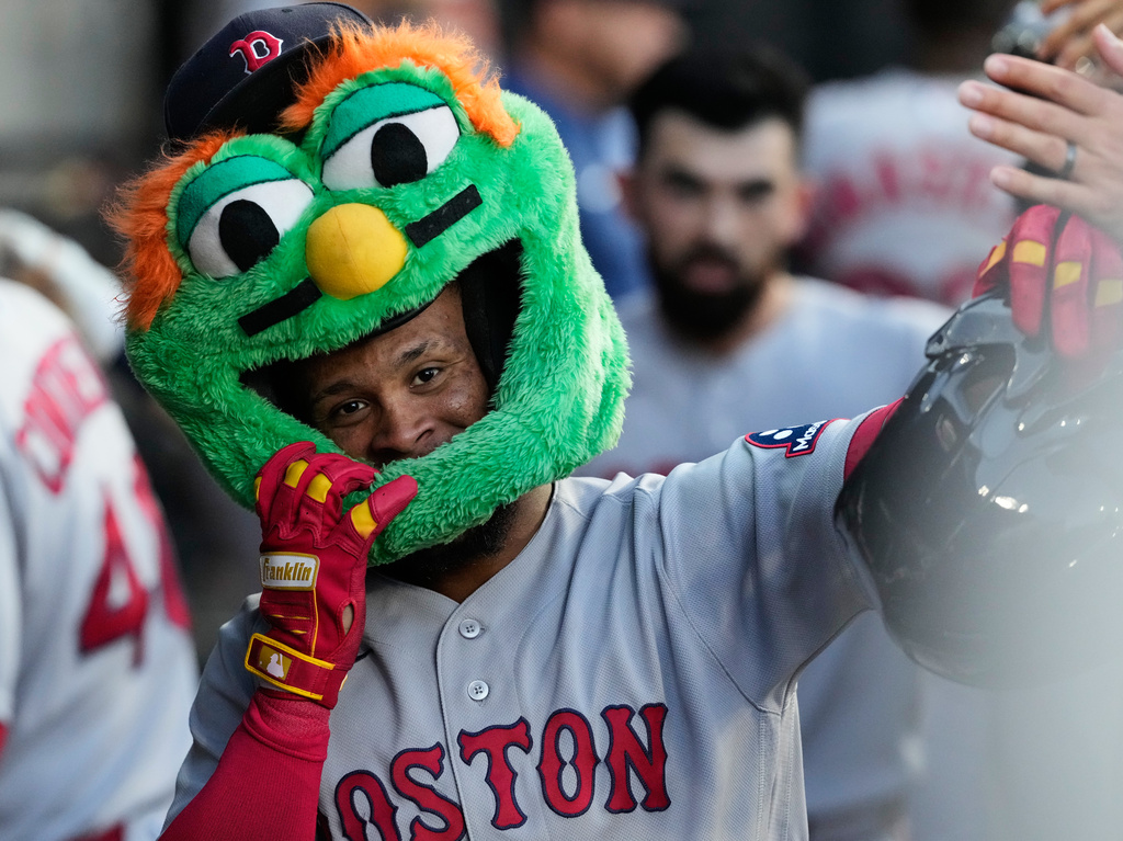 Boston Red Sox's Ceddanne Rafaela celebrates with teammates after hitting a two-run home run during the second inning of a baseball game against the Chicago White Sox in Chicago, Tuesday, July 7, 2026. (AP Photo/Nam Y. Huh)