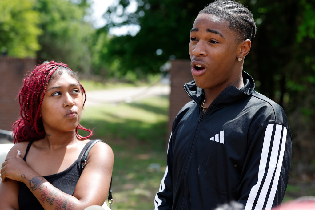 Jeremiah Braxton, who was at the party, talks to the media at the entrance to Scissortail Campground at Arcadia Lake in Edmond, Okla. on Monday, May 4, 2026 after a shooting on Sunday evening. (AP Photo/Alonzo Adams)