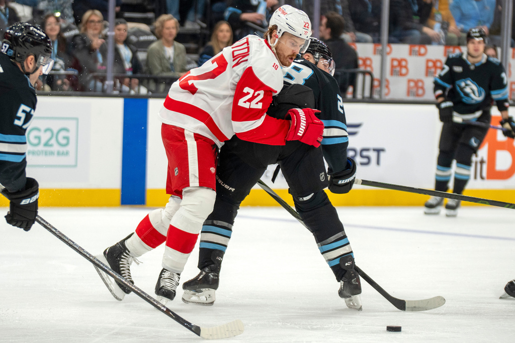 Detroit Red Wings center Mason Appleton (22) tries to get past Utah Mammoth defenseman Ian Cole (28) during the second period of an NHL hockey game Wednesday, Feb. 4, 2026, in Salt Lake City. (AP Photo/Rick Egan)