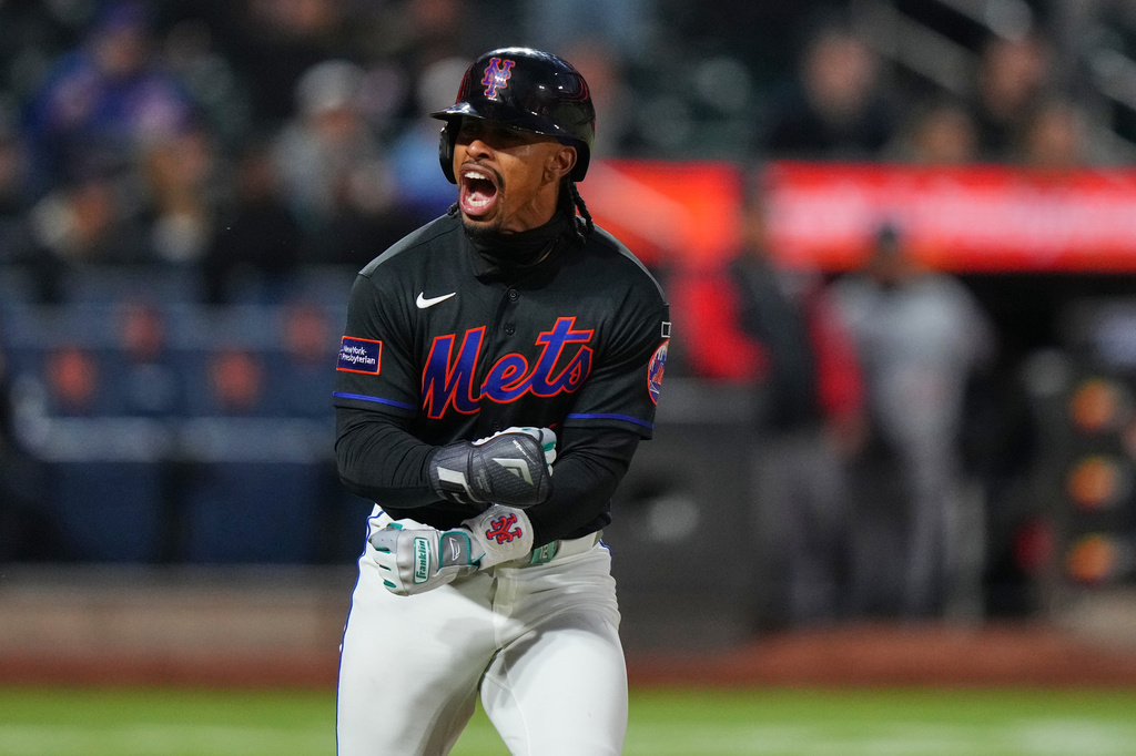 New York Mets' Francisco Lindor celebrates after hitting a three-run home run during the third inning of a baseball game against the Minnesota Twins Tuesday, April 21, 2026, in New York. (AP Photo/Frank Franklin II)