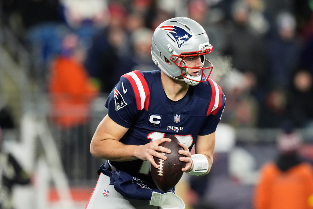 New England Patriots quarterback Drake Maye runs during the second half of an NFL football game against the Miami Dolphins in Foxborough, Mass., Sunday, Jan. 4, 2026. (AP Photo/Robert F. Bukaty)