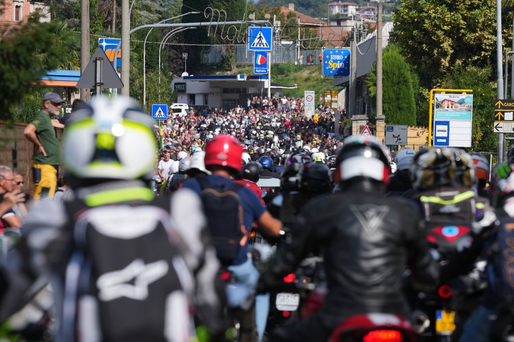 Guzzi bikers run during the Grand Parade in Mandello del Lario on Lake Como, part of the Moto Guzzi World Days 2026, as the maker celebrates its 105th anniversary, in Lecco, Italy, Saturday, Sept. 5, 2026. (AP Photo/Luca Bruno)