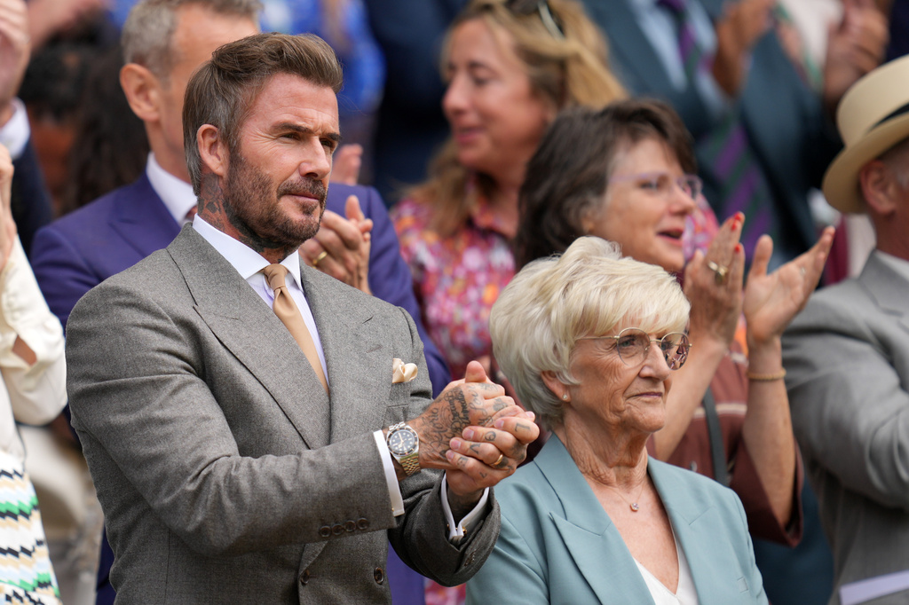 Soccer legend David Beckham and his mother Sandra Georgina Beckham watch the men's singles match between Jannik Sinner of Italy and Miomir Kecmanovic of Serbia at the Wimbledon Tennis Championships in London, Monday, June 29, 2026.(AP Photo/Kin Cheung)