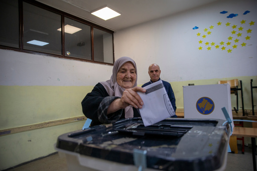 Voters cast their ballot for the municipal elections in Pristina, Kosovo on Sunday, Oct. 12, 2025. (AP Photo/Visar Kryeziu) Voters cast their ballot for the municipal elections in Pristina, Kosovo on Sunday, Oct. 12, 2025. (AP Photo/Visar Kryeziu)