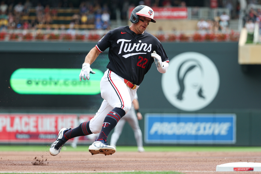 Minnesota Twins' Brooks Lee rounds third base to score on a single hit by designated hitter Josh Bell during the first inning of a baseball game against the Chicago White Sox, Sunday, Aug. 30, 2026, in Minneapolis. (AP Photo/Matt Krohn)