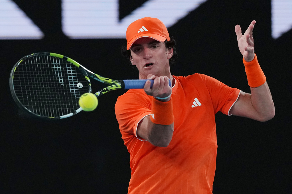 Keaton Hance of the U.S. plays a forehand return to Ziga Sesko of Slovenia during the boy's singles final at the Australian Open tennis championship in Melbourne, Australia, Sunday, Feb. 1, 2026. (AP Photo/Dar Yasin)