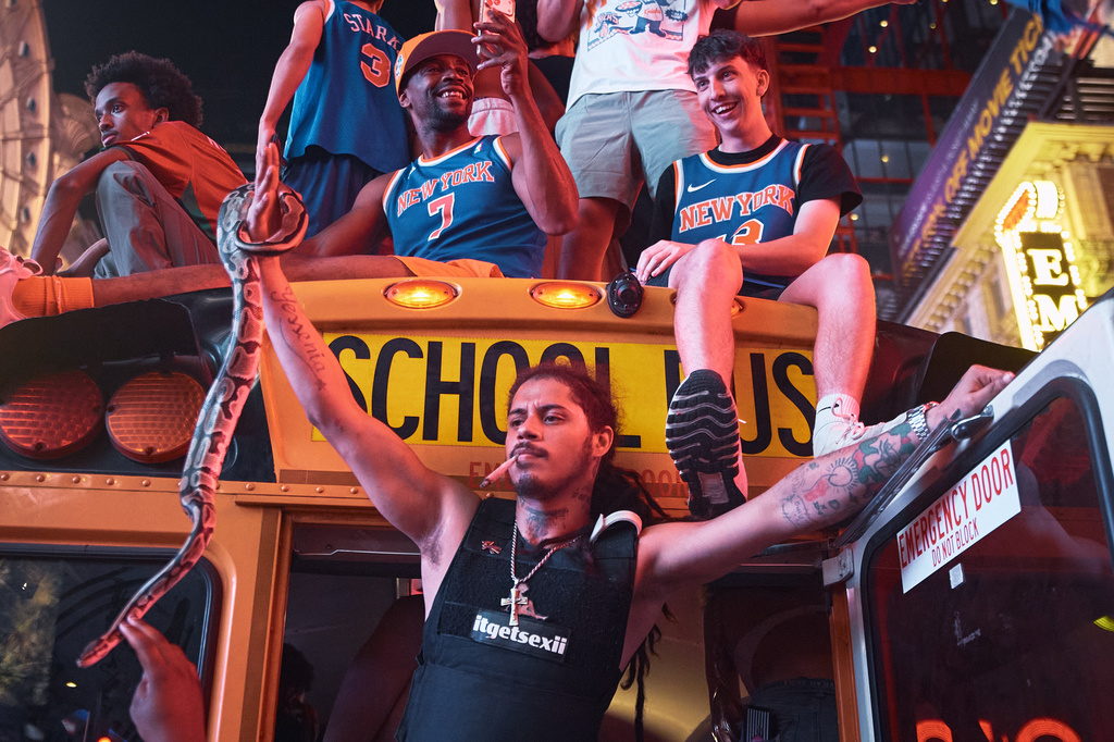 New York Knicks fans celebrate in the streets after the Knicks defeated the San Antonio Spurs to win the NBA Finals, Saturday, June 13, 2026, in New York. (AP Photo/Andres Kudacki)