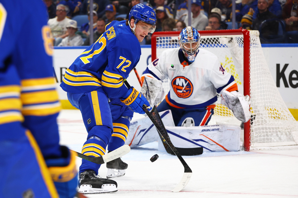 Buffalo Sabres center Tage Thompson (72) tips the puck in front of New York Islanders goaltender Ilya Sorokin (30) during the first period of an NHL hockey game Tuesday, March 31, 2026, in Buffalo, N.Y. (AP Photo/Jeffrey T. Barnes)
