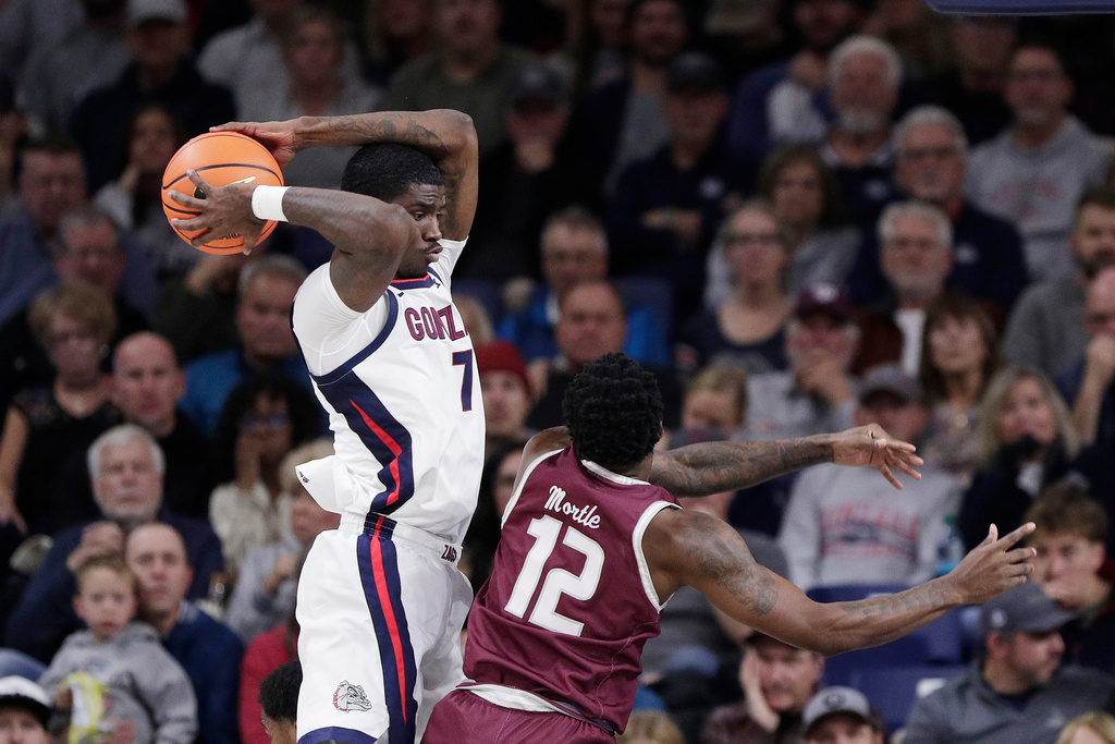 Gonzaga guard Tyon Grant-Foster (7) grabs a rebound next to Texas Southern guard Zytarious Mortle (12) during the first half of an NCAA college basketball game, Monday, Nov. 3, 2025, in Spokane, Wash. (AP Photo/Young Kwak)