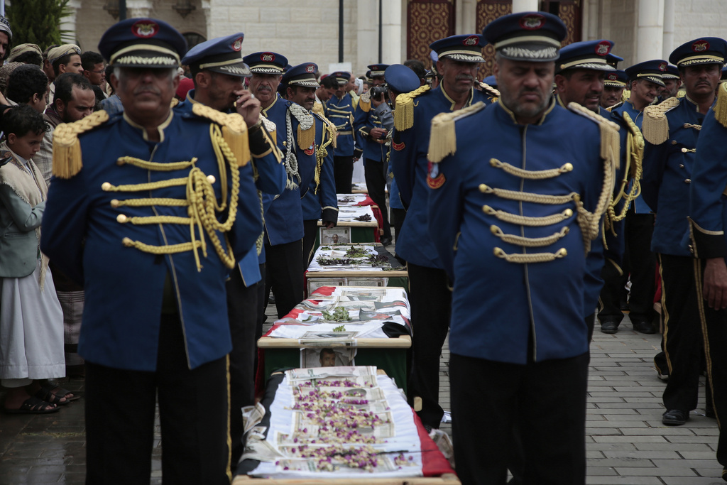 Yemeni honor guards stand beside the coffins of 31 local journalists reportedly killed in Israeli airstrikes last week, during their funeral in Sanaa, Yemen, Tuesday, Sept. 16, 2025. (AP Photo/Osamah Abdulrahman)
