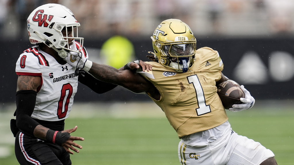 Georgia Tech running back Jamal Haynes (1) runs after a catch against Gardner-Webb safety Wendell McClain (0) during the first half of an NCAA college football game, Saturday, Sept. 6, 2025, in Atlanta. (AP Photo/Mike Stewart)