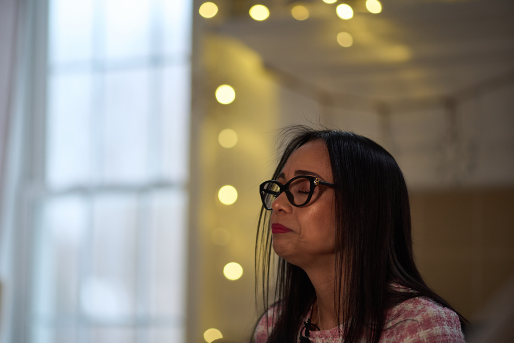 Ruth Wilson, whose lupus took six years to diagnose, fights back tears while talking about her condition, Sunday, Jan. 12, 2025, during an interview at her home in Littleton, Mass. (AP Photo/David Goldman)
