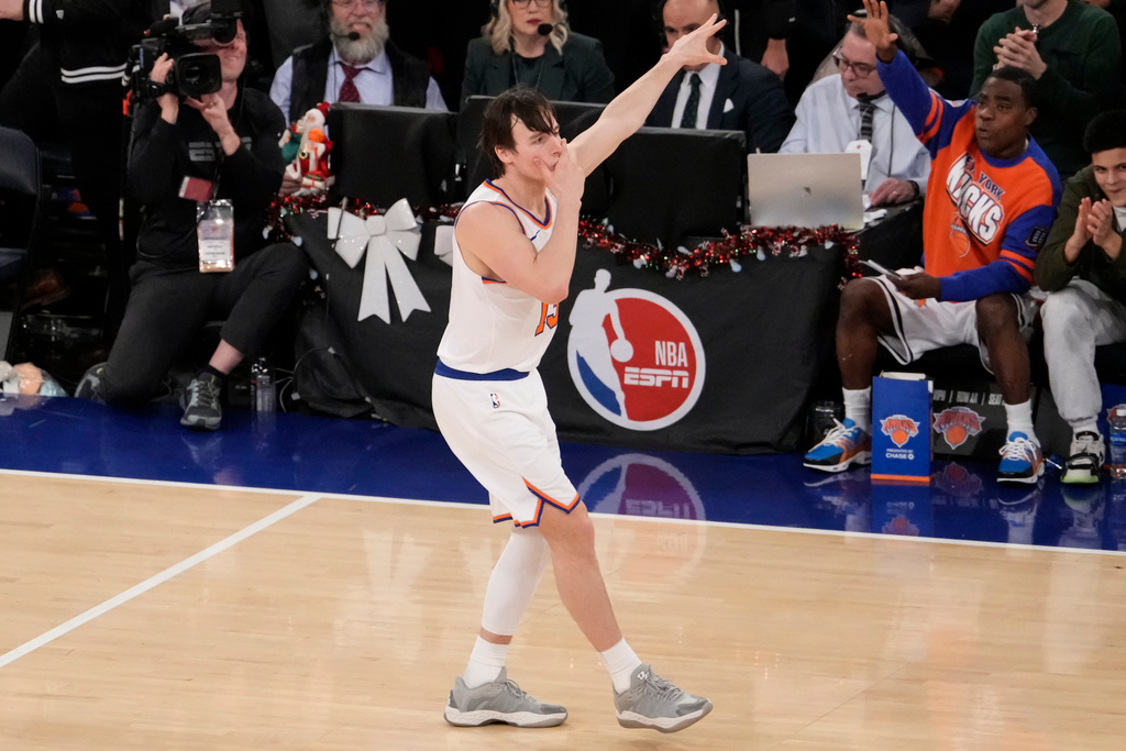 New York Knicks guard Tyler Kolek (13) reacts after scoring a three point goal during the second half of an NBA basketball game against the Cleveland Cavaliers, Thursday, Dec. 25, 2025, in New York. (AP Photo/Yuki Iwamura)
