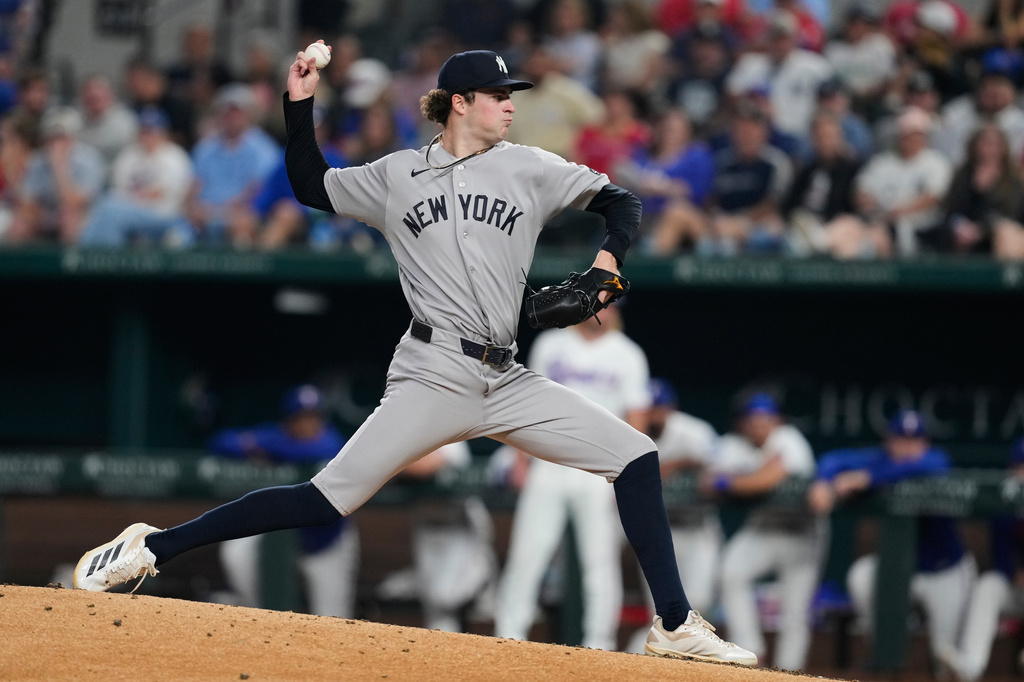 New York Yankees pitcher Cam Schlittler throws to the Texas Rangers in the fourth inning of a baseball game Tuesday, April 28, 2026, in Arlington, Texas. (AP Photo/Tony Gutierrez)