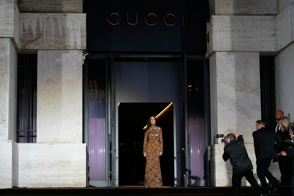 Demi Moore arrives for the premiere of the short film "The Tiger," directed by Spike Jonze and Halina Reijn, featuring the first looks by Gucci's new creative director, Demna, in Milan, northern Italy, Tuesday, Sept. 23, 2025. (AP Photo/Luca Bruno)