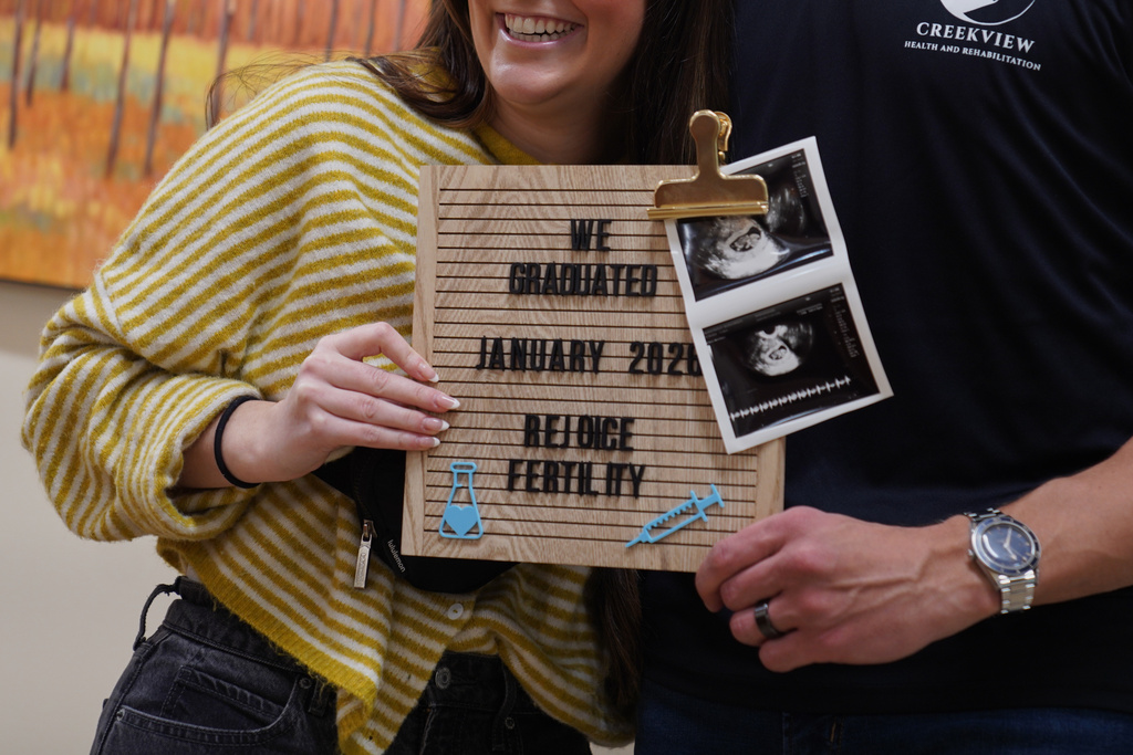 IVF patients Maggie and Cade Lichfield take a photo after getting their final ultrasound at Rejoice Fertility, Jan. 9, 2026, in Knoxville, Tenn. (AP Photo/Jessie Wardarski)
