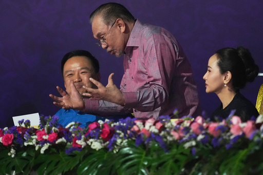 Malaysia's Prime Minister Anwar Ibrahim, center, speaks with Thailand's Prime Minister Anutin Charnvirakul, left, and his wife Sasithorn Chantarasomboon as they attends the gala dinner of the 47th Association of Southeast Asian Nations (ASEAN) Summit in Kuala Lumpur, Malaysia, Monday, Oct. 27, 2025. (AP Photo/Rafiq Maqbool/Pool) Malaysia's Prime Minister Anwar Ibrahim, center, speaks with Thailand's Prime Minister Anutin Charnvirakul, left, and his wife Sasithorn Chantarasomboon as they attends the gala dinner of the 47th Association of Southeast Asian Nations (ASEAN) Summit in Kuala Lumpur, Malaysia, Monday, Oct. 27, 2025. (AP Photo/Rafiq Maqbool/Pool)