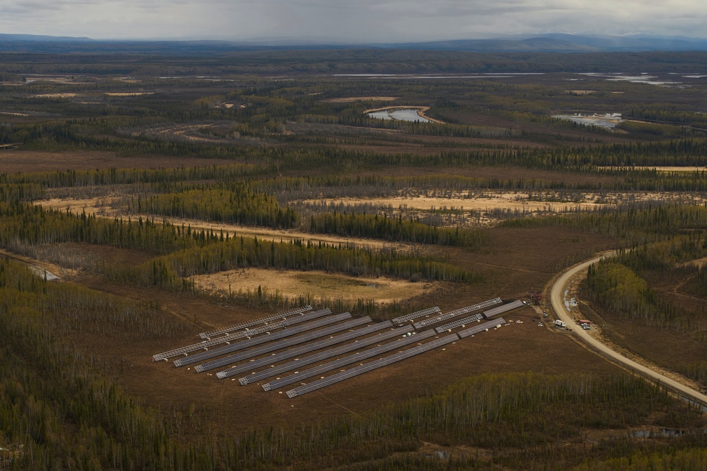 FILE - Workers install panels for a solar energy project Wednesday, May 21, 2025, in Galena, Alaska. (AP Photo/John Locher, File)