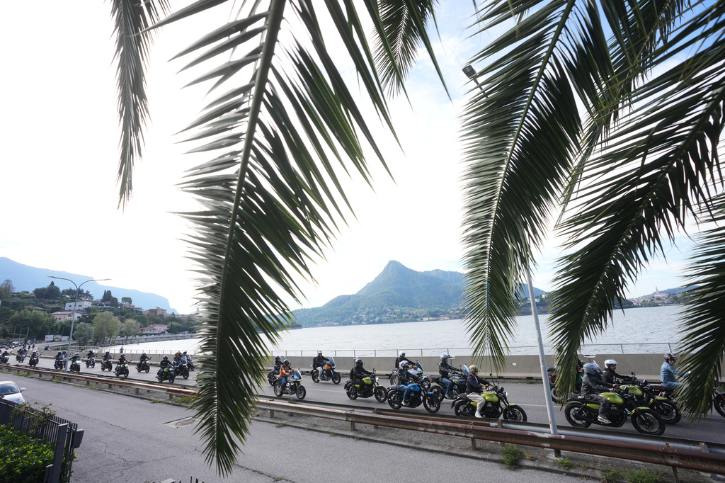 Guzzi bikers run during the Grand Parade along the route from Lecco to Mandello del Lario on Lake Como, part of the Moto Guzzi World Days 2026, as the maker celebrates its 105th anniversary, in Lecco, Italy, Saturday, Sept. 5, 2026. (AP Photo/Luca Bruno)