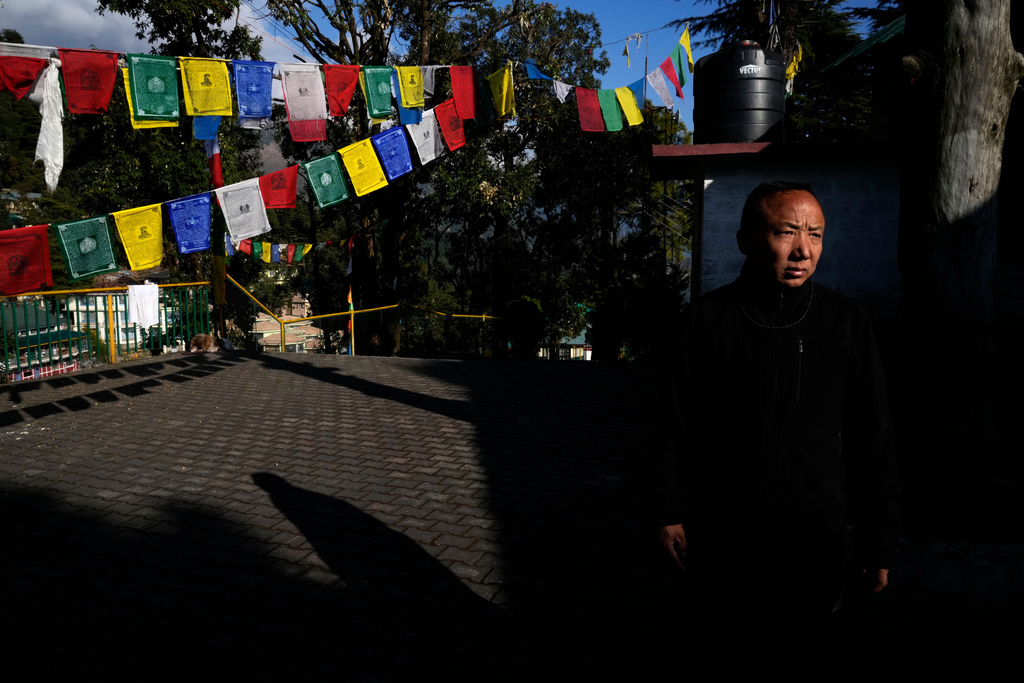 Sonam Tashi takes a walk in a temple at the Tibetan Children's Village school in Mcleodganj near Dharamshala, India, March 6, 2025. (AP Photo/Manish Swarup)