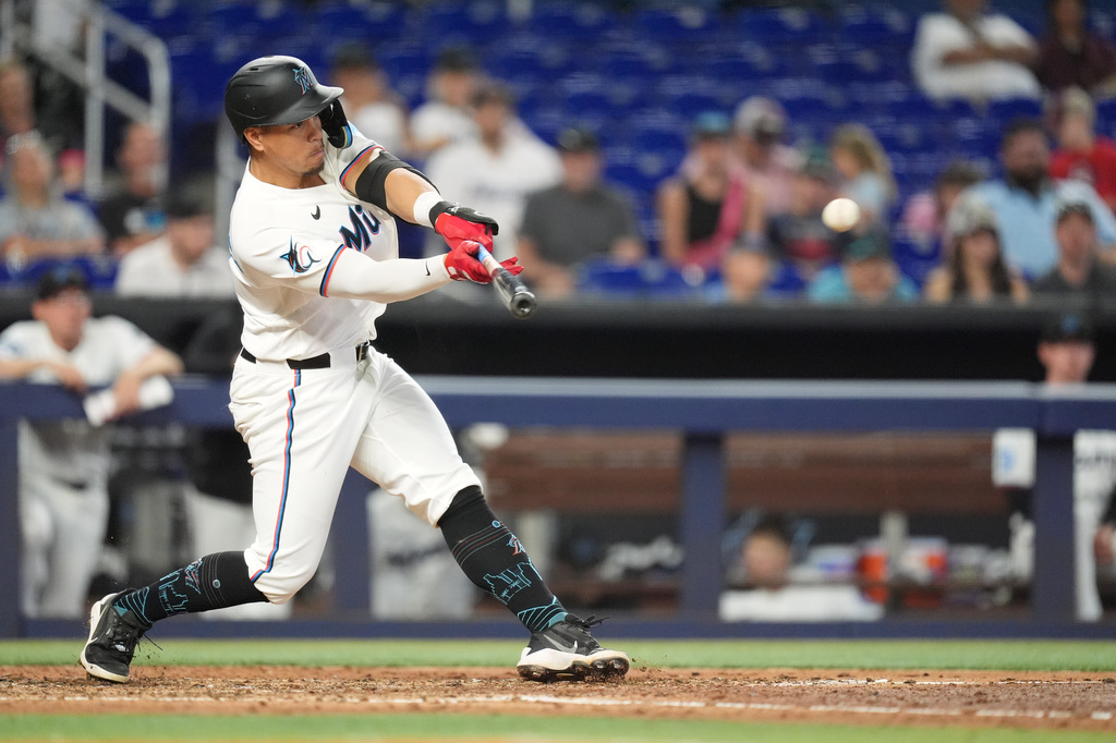 Miami Marlins' Heriberto Hernandez hits a single during the fifth inning of a baseball game against the St. Louis Cardinals, Wednesday, April 22, 2026, in Miami. (AP Photo/Rebecca Blackwell)