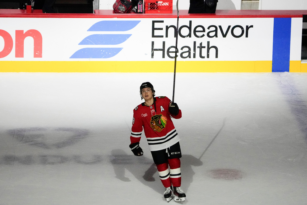 Chicago Blackhawks center Connor Bedard celebrates a win against the Calgary Flames in an NHL hockey game, Tuesday, Nov. 18, 2025, in Chicago. (AP Photo/David Banks)