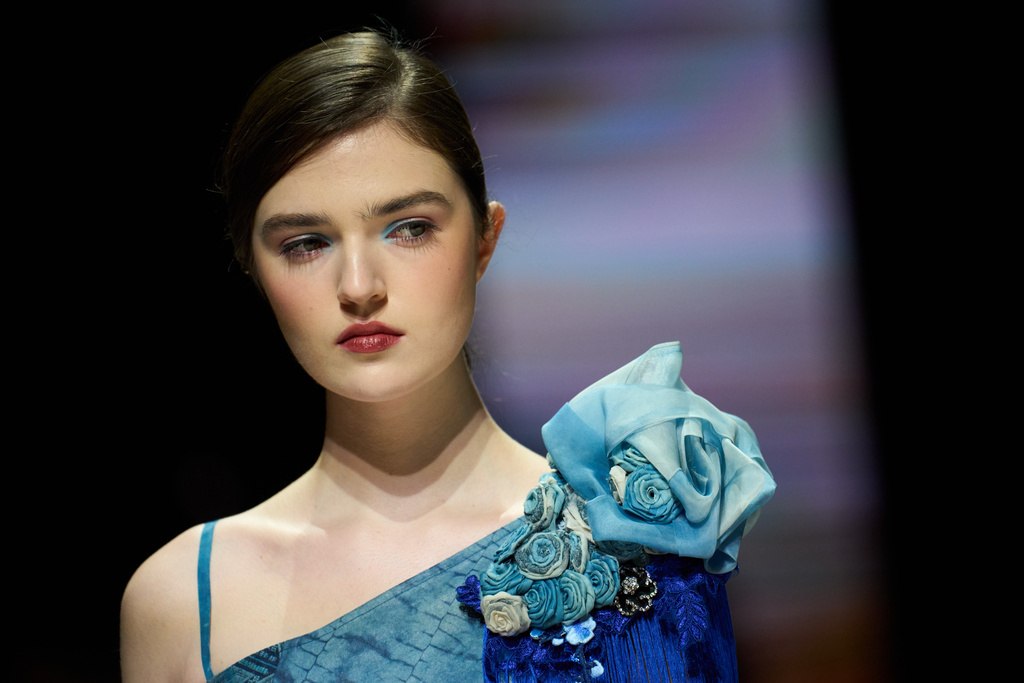 A model wears a creation by Chinese brand Xuaujin on a runway at the Moscow Fashion Week in Moscow, Sunday, March 15, 2026. (AP Photo/Alexander Zemlianichenko)
