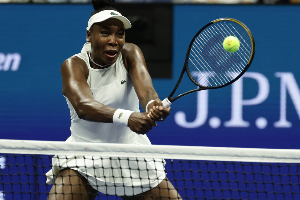 Venus Williams, of the United States, hits a return as she plays a women's doubles match with partner Serena Williams against Hao-Ching Chan, of Taiwan, and Maya Joint, at the U.S. Open tennis championships, Friday, Sept. 4, 2026, in New York. (AP Photo/Adam Hunger)