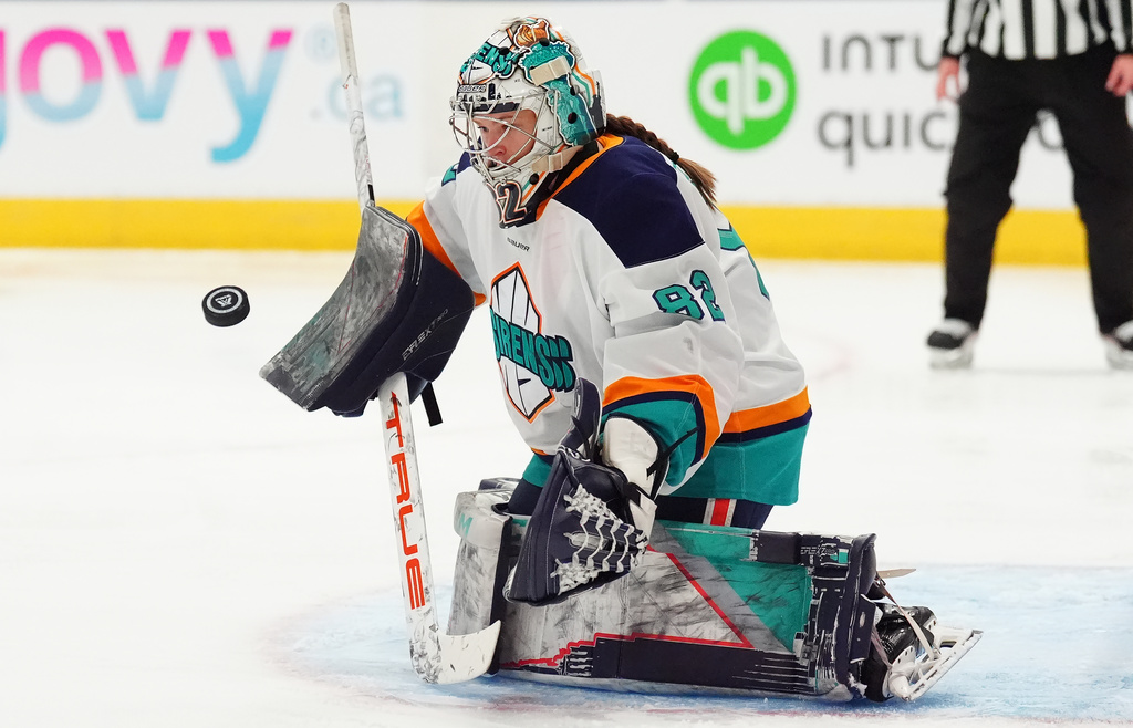 New York Sirens goaltender Kayle Osborne (82) makes a save against the Toronto Sceptres during the second period of an PWHL hockey game in Toronto on Tuesday, April 21, 2026. (Frank Gunn/The Canadian Press via AP)