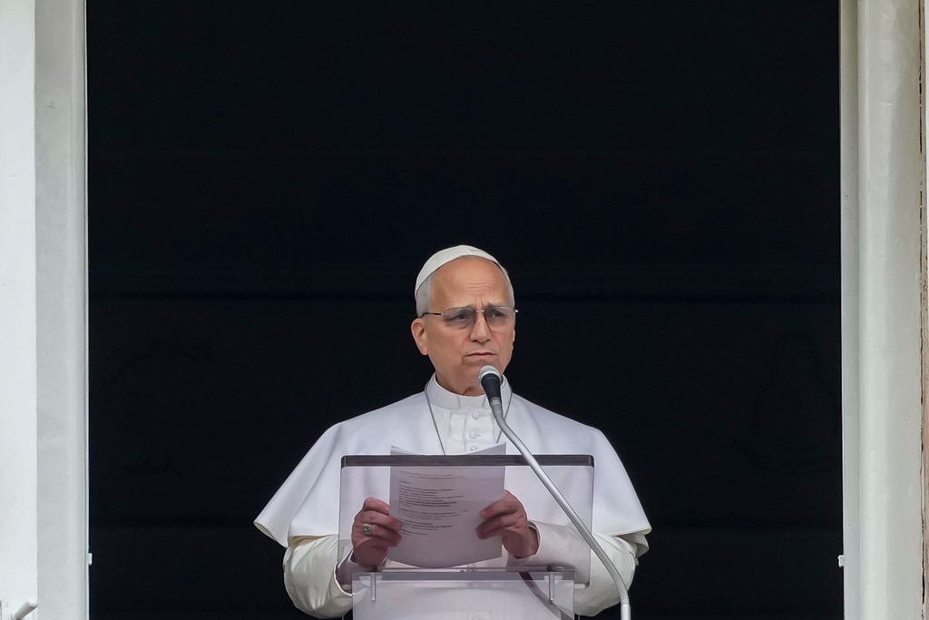 Pope Leo XIV appears at the window of his studio overlooking St. Peter's Square at the Vatican where Catholic faithful and pilgrims gathered for the traditional Sunday blessing at the end of the noon Angelus prayer, Sunday, March 15, 2026. (AP Photo/Andrew Medichini)