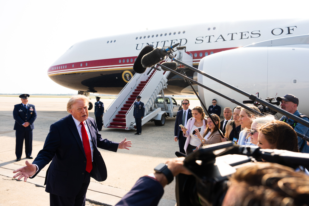 President Donald Trump speaks with reporters before boarding the new Air Force One, Wednesday, July 1, 2026, at Joint Base Andrews, Md. (AP Photo/Julia Demaree Nikhinson)
