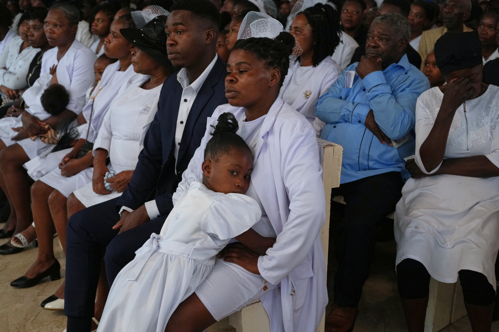 Relatives attend the funeral service for victims of a gang attack in the Kenscoff neighborhood of Port-au-Prince, Haiti, Wednesday, Sept. 2, 2026. (AP Photo/Odelyn Joseph)