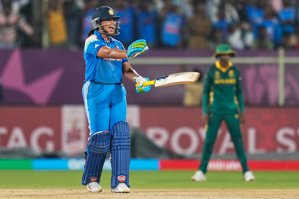 India's Richa Ghosh reacts to her batting partner as she is caught by South Africa's Chole Tryon during the ICC Women's Cricket World Cup match between India and South Africa at ACA-VDCA Cricket Stadium in Visakhapatnam, India, Thursday, Oct. 9, 2025. (AP Photo/Aijaz Rahi)
