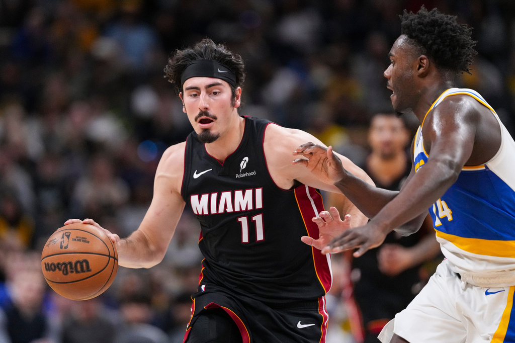 Miami Heat forward Jaime Jaquez Jr. (11) drives on Indiana Pacers guard Kobe Brown (24) during the second half of an NBA basketball game in Indianapolis, Sunday, March 29, 2026. (AP Photo/Michael Conroy)