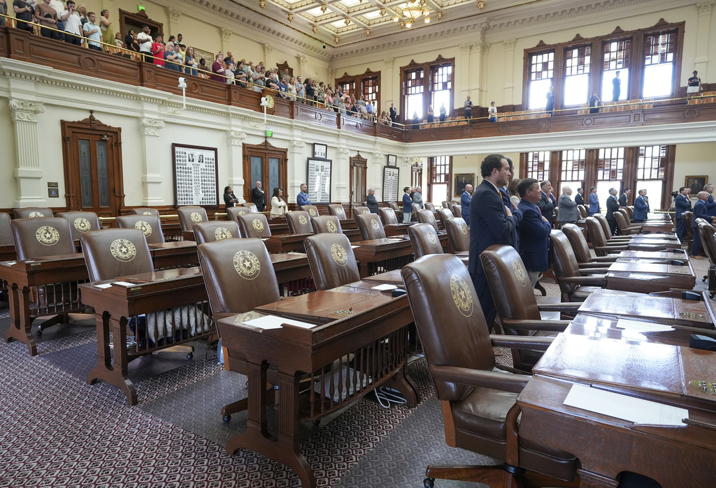 Many seats remain empty during the session in the House Chamber at the Capitol in Austin,, Texas, Monday, Aug. 11, 2025. (Jay Janner/Austin American-Statesman via AP)
