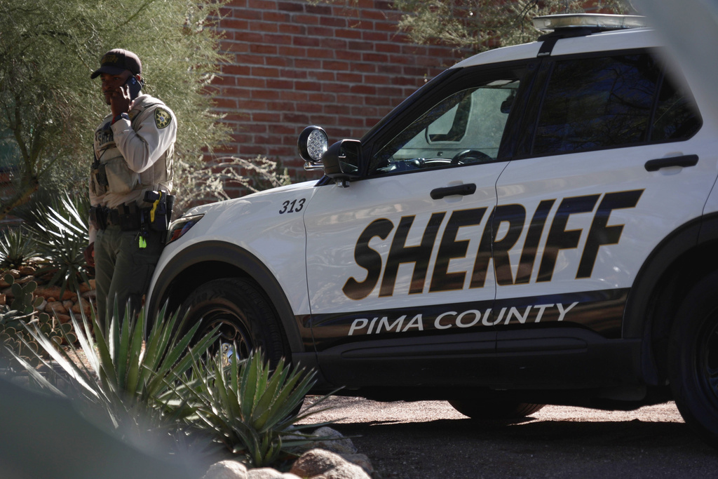 A Pima County sheriffs official stays outside of Nancy Guthrie‘s home on Saturday, Feb. 14, 2026 in Tucson, Ariz. (AP Photo/Ty O'Neil)