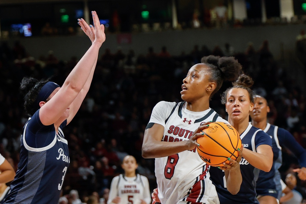 South Carolina forward Joyce Edwards (8) drives to the basket against Penn State guard Moriah Murray, left, during the first half of an NCAA college basketball game in Columbia, S.C., Sunday, Dec. 14, 2025. (AP Photo/Nell Redmond)
