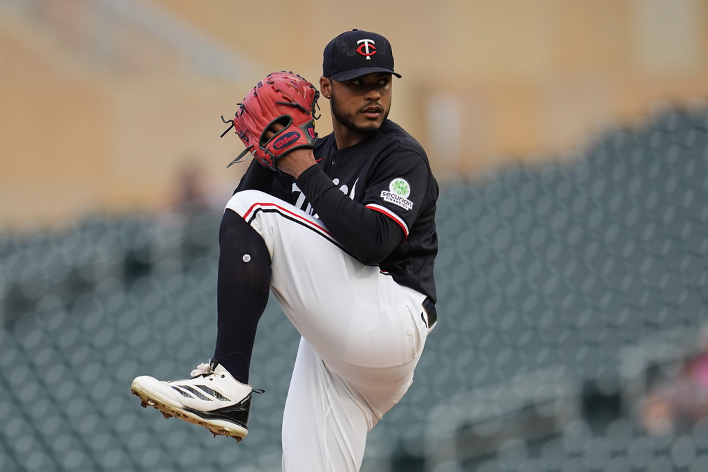 Minnesota Twins starting pitcher Taj Bradley winds up to deliver during the first inning of a baseball game against the Detroit Tigers, Monday, Aug. 31, 2026, in Minneapolis. (AP Photo/Abbie Parr)