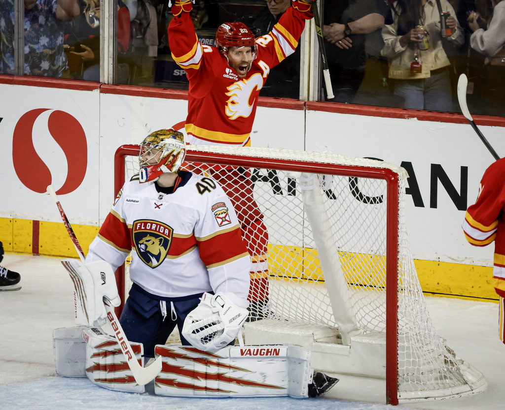 Florida Panthers goalie Daniil Tarasov reacts as Calgary Flames' Blake Coleman celebrates a goal during the second period of an NHL hockey game in Calgary on Friday, March 20, 2026. (Jeff McIntosh/The Canadian Press via AP)