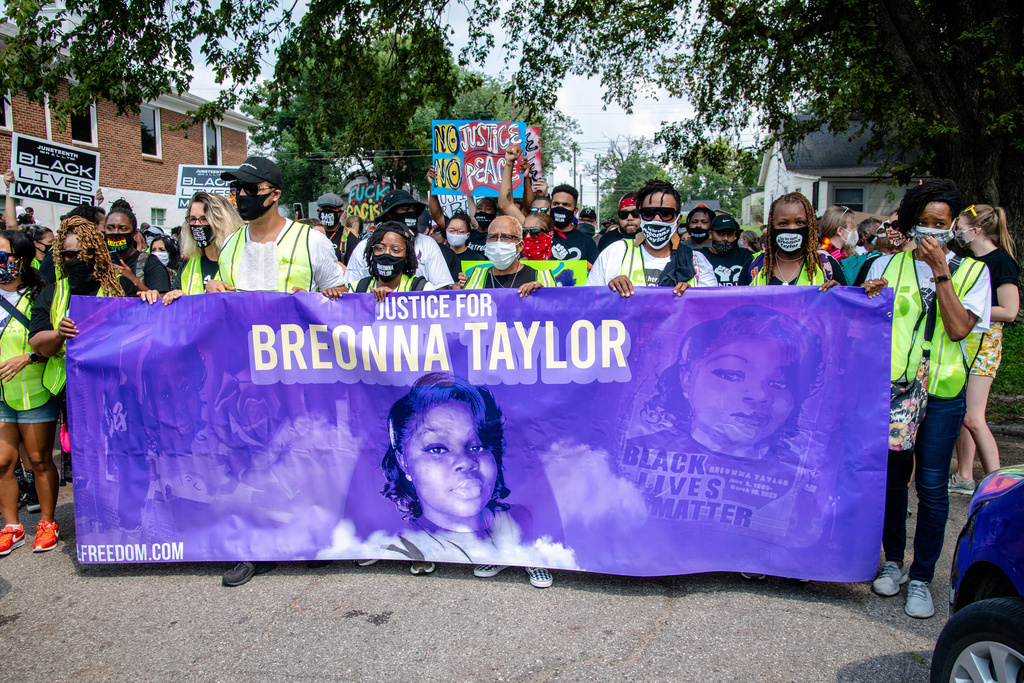 FILE - Protesters participate in the Good Trouble Tuesday march for Breonna Taylor, on Tuesday, Aug. 25, 2020, in Louisville, Ky. (Amy Harris/Invision/AP, File)
