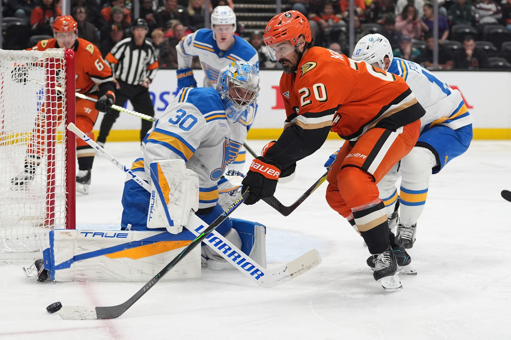 St. Louis Blues goaltender Joel Hofer (30) blocks a shot from Anaheim Ducks left wing Chris Kreider (20) during the third period of an NHL hockey game Friday, April 3, 2026, in Anaheim, Calif. (AP Photo/Gregory Bull)