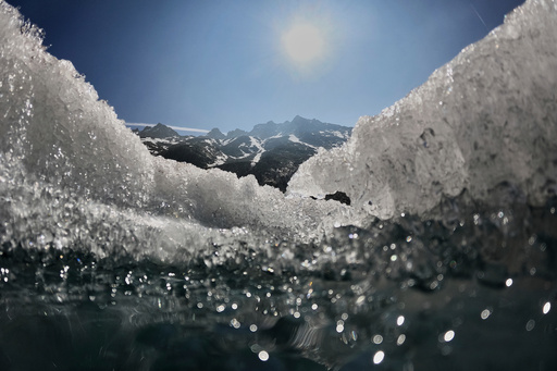 FILE - The sun shines over the melting Rhone Glacier near Goms, Switzerland, on June 10, 2025. (AP Photo/Matthias Schrader, File) FILE - The sun shines over the melting Rhone Glacier near Goms, Switzerland, on June 10, 2025. (AP Photo/Matthias Schrader, File)