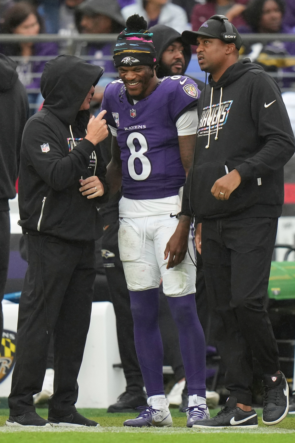 Baltimore Ravens quarterback Lamar Jackson (8) talks to team personnel on the sideline during the second half of an NFL football game against the Tennessee Titans in Baltimore, Sunday, Oct. 4, 2026. (AP Photo/Stephanie Scarbrough)
