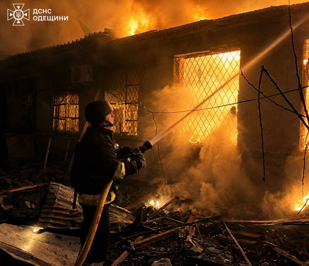 In this photo provided by the Ukrainian Emergency Service, firefighters put out a fire a building following a Russian drone attack in Odesa region, Ukraine, Saturday, May 2, 2026. (Ukrainian Emergency Service via AP)
