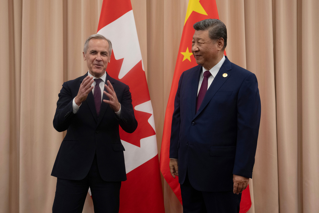 Canadian Prime Minister Mark Carney, left, meets Chinese President Xi Jinping at the start of a meeting in Gyeongju, South Korea, Friday, Oct. 31, 2025. (Adrian Wyld/The Canadian Press via AP) Canadian Prime Minister Mark Carney, left, meets Chinese President Xi Jinping at the start of a meeting in Gyeongju, South Korea, Friday, Oct. 31, 2025. (Adrian Wyld/The Canadian Press via AP)