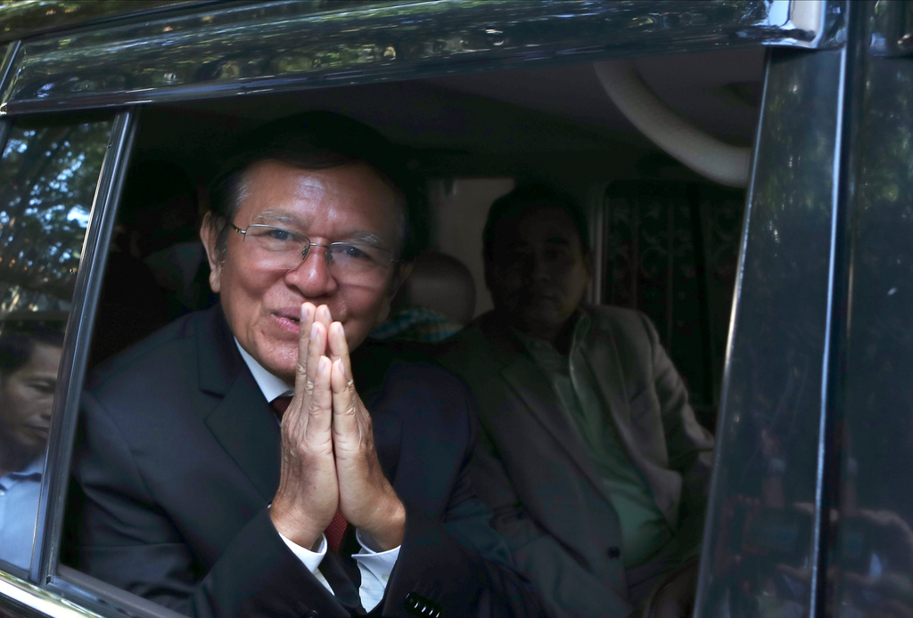 FILE - Former President of Cambodia National Rescue Party, Kem Sokha, greets from his car in front of his house in Phnom Penh, Cambodia, Friday, March 3, 2023. (AP Photo/Heng Sinith, file)