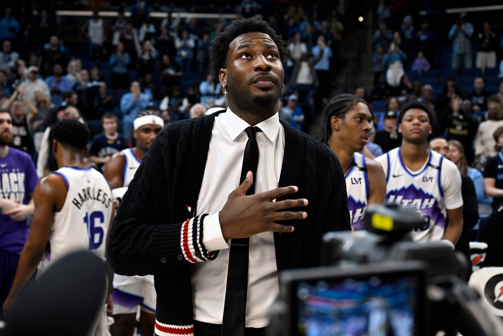 Utah Jazz forward Jaren Jackson Jr. looks on during a video tribute from his former team, the Memphis Grizzlies, in the first half of an NBA basketball game between the teams Friday, Feb. 20, 2026, in Memphis, Tenn. (AP Photo/Brandon Dill)
